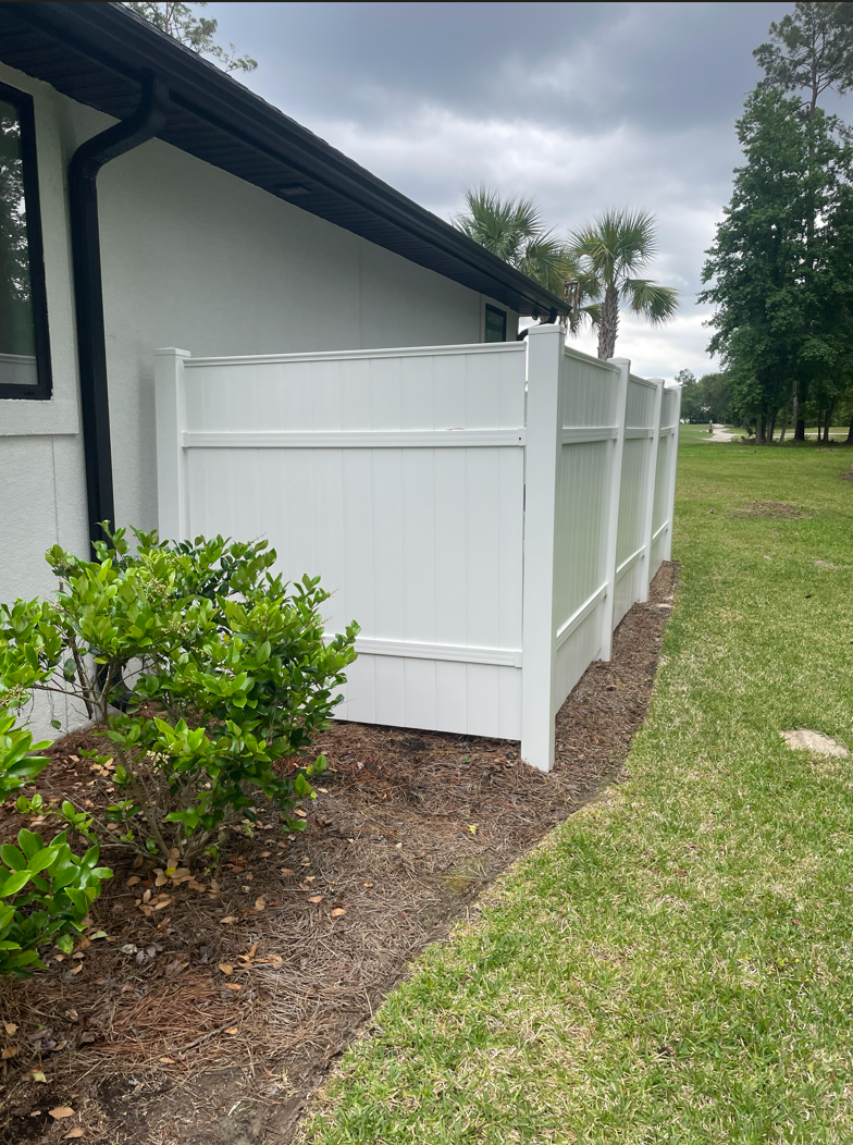 Vinyl fence after cleaning with a bright white finish